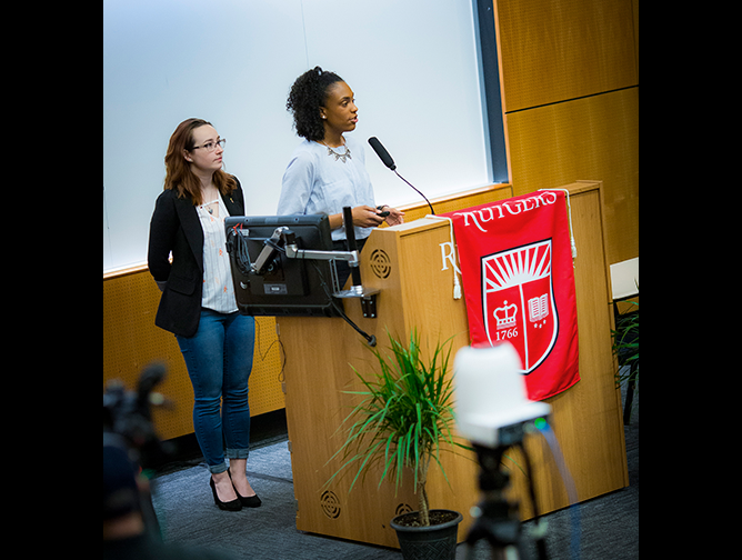 Devin Ellison and Gabrielle Dilenno present their research at the symposium